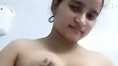 Bengali girl in bathroom strips dresses and nude show