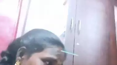 Mature tattooed Tamil wife giving handjob to husband