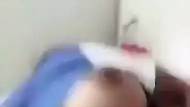 Beautiful desi girl lifting top to reveal sexy boobs
